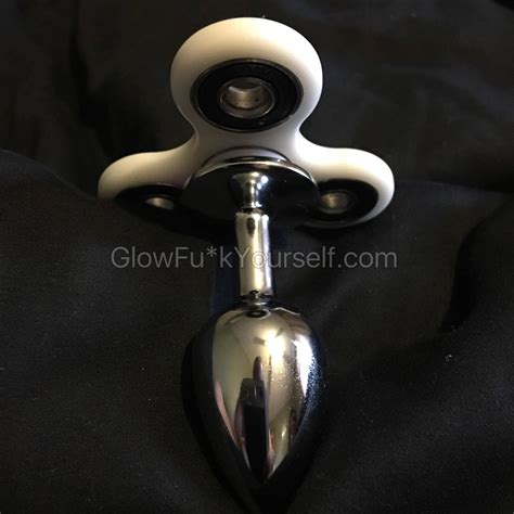 She knows fidget spinners are all the hype right now and shes a trendy girl, so she got herself a colorful fidget spinner butt plug that fits snugly in her deliciously tight asshole Finally a good use for those spinner things. . Fidget spinner butt plugs